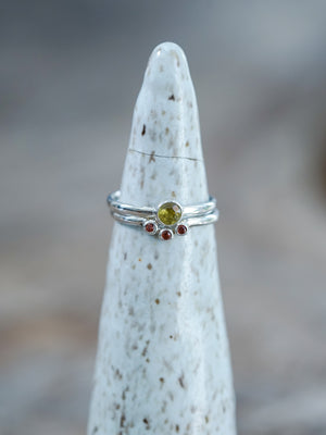 A Yellow Sphene and Garnet Ring Set in sterling silver