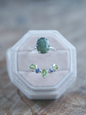 A set of two rings: Sapphire, Peridot, and Opal Ring Set in velvet box