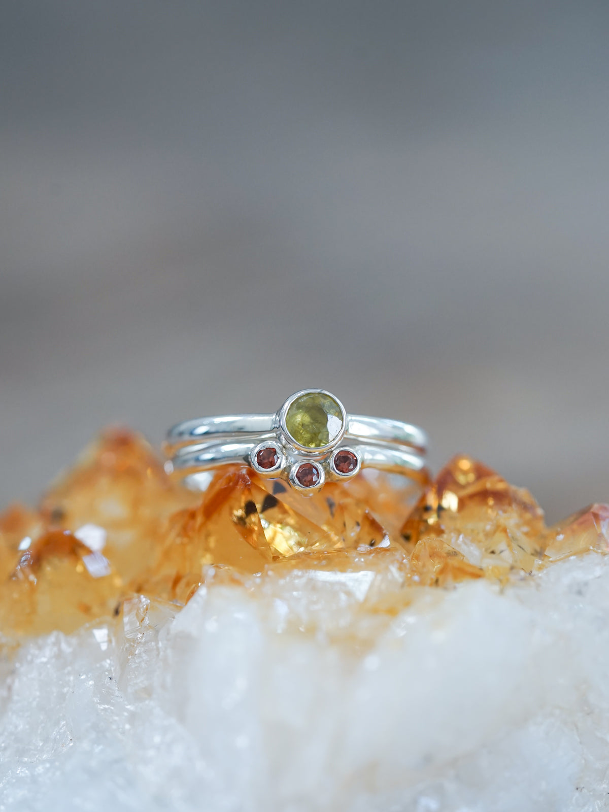 A Sphene and Garnet Ring Set in sterling silver