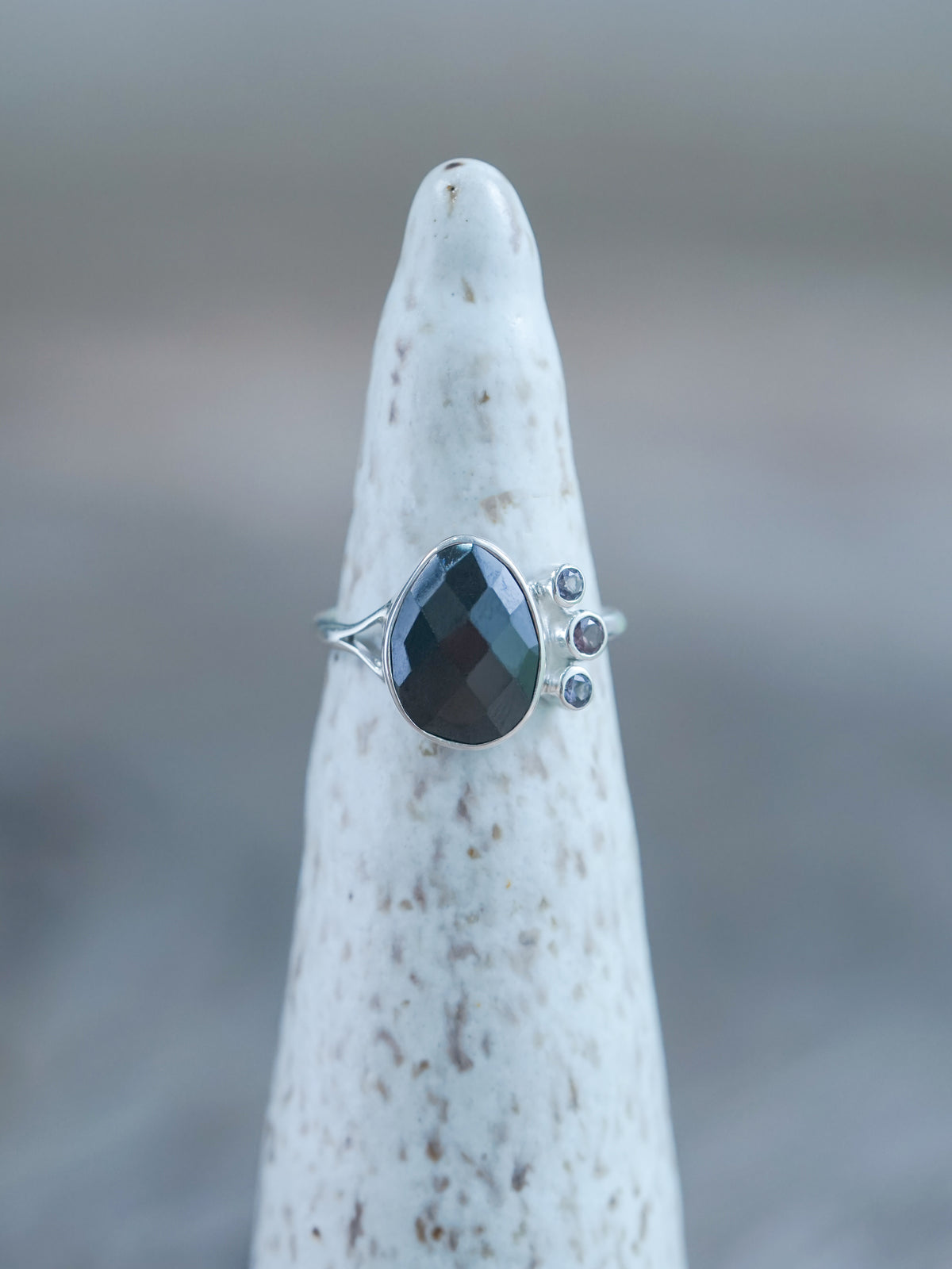 Black Onyx and 3 Purple Spinel Ring in Recycled sterling silver on display